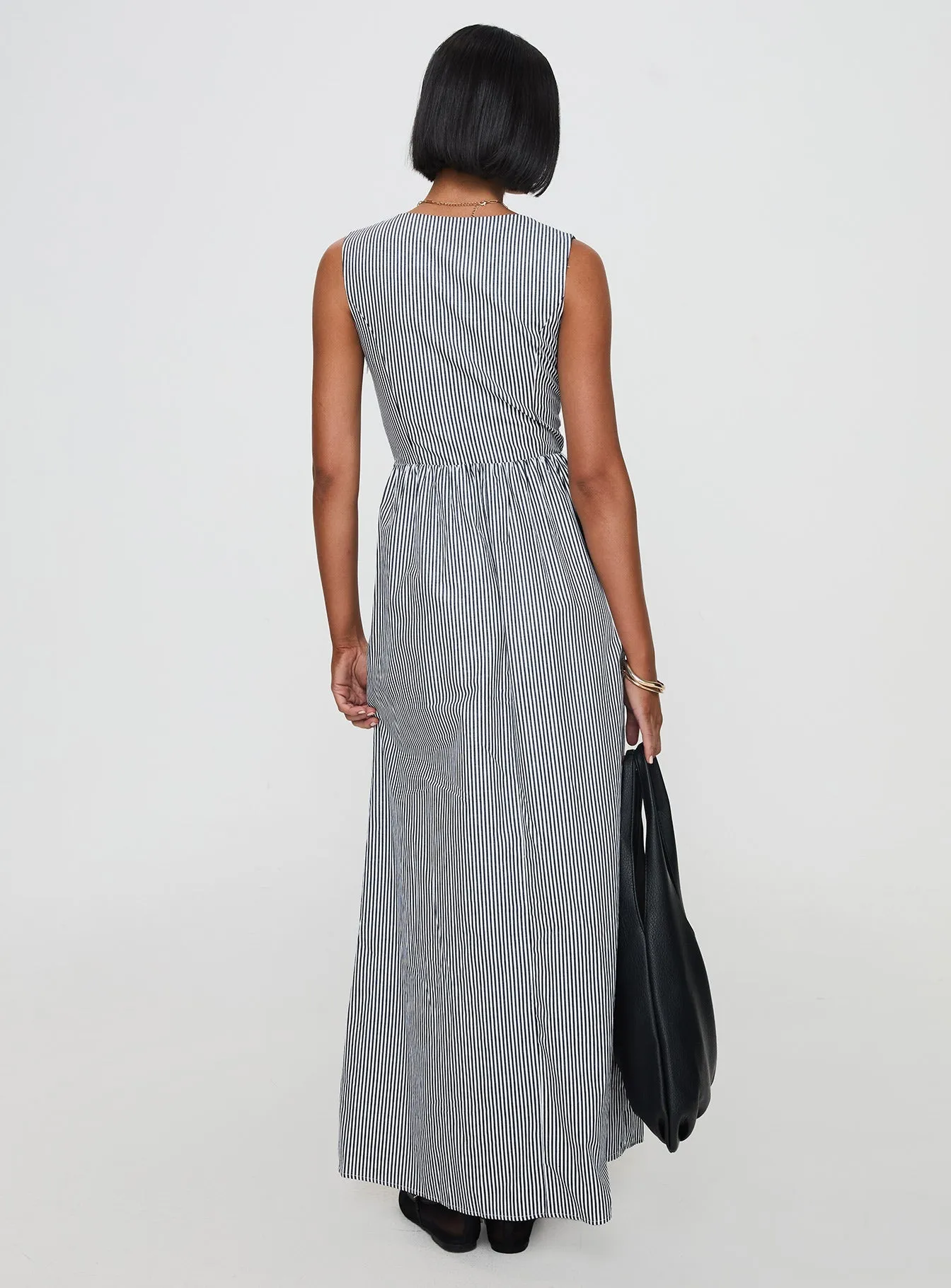 This dress offers a comfortable and elegant fit that works for both casual and formal events Perfect for a day out or a night on the town this dress offers endless styling possibilities Pokey Maxi Dress Black / White Stripe