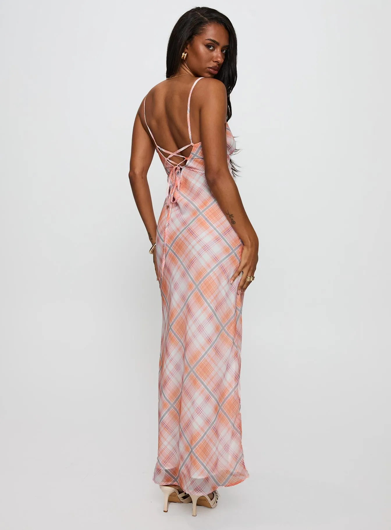 Yazmina Maxi Dress Orange Check The dress??s versatile design allows you to wear it for work, weekend outings, or evening events The elegant cut of this dress highlights your figure while offering plenty of room to move