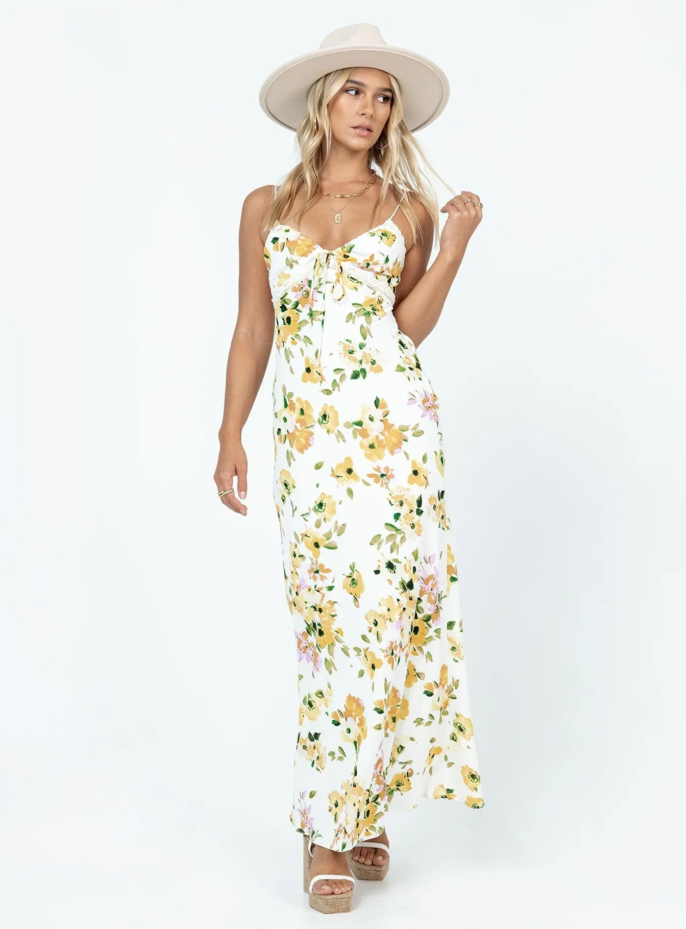 Emily Maxi Dress White / Yellow Floral Harbor View The flowing design of this dress ensures freedom of movement while looking sophisticated