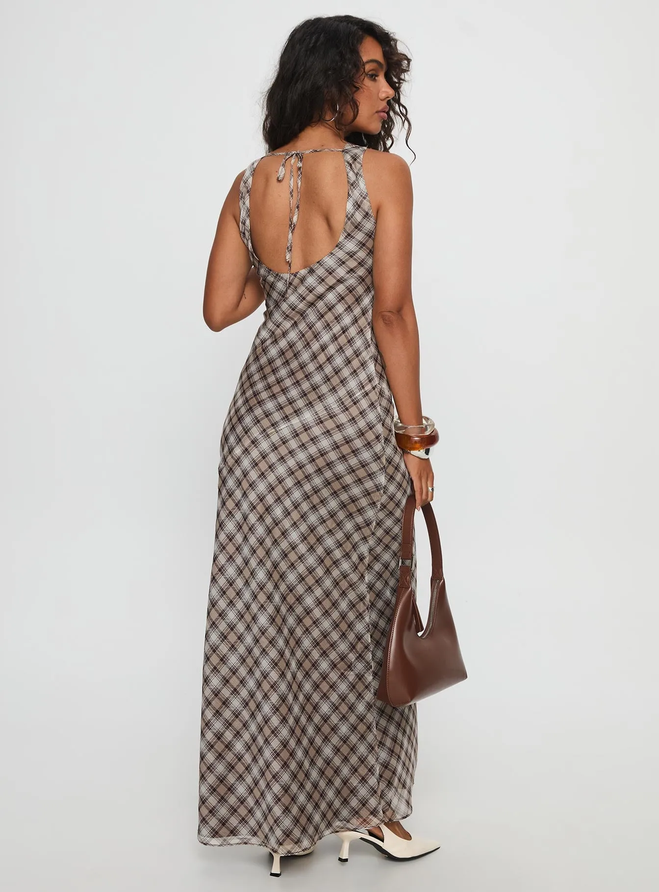 Vibrant floral maxi With a flowy skirt and a structured top this maxi dress offers a perfect balance of comfort and style Veida Cowl Neck Maxi Dress Brown Check