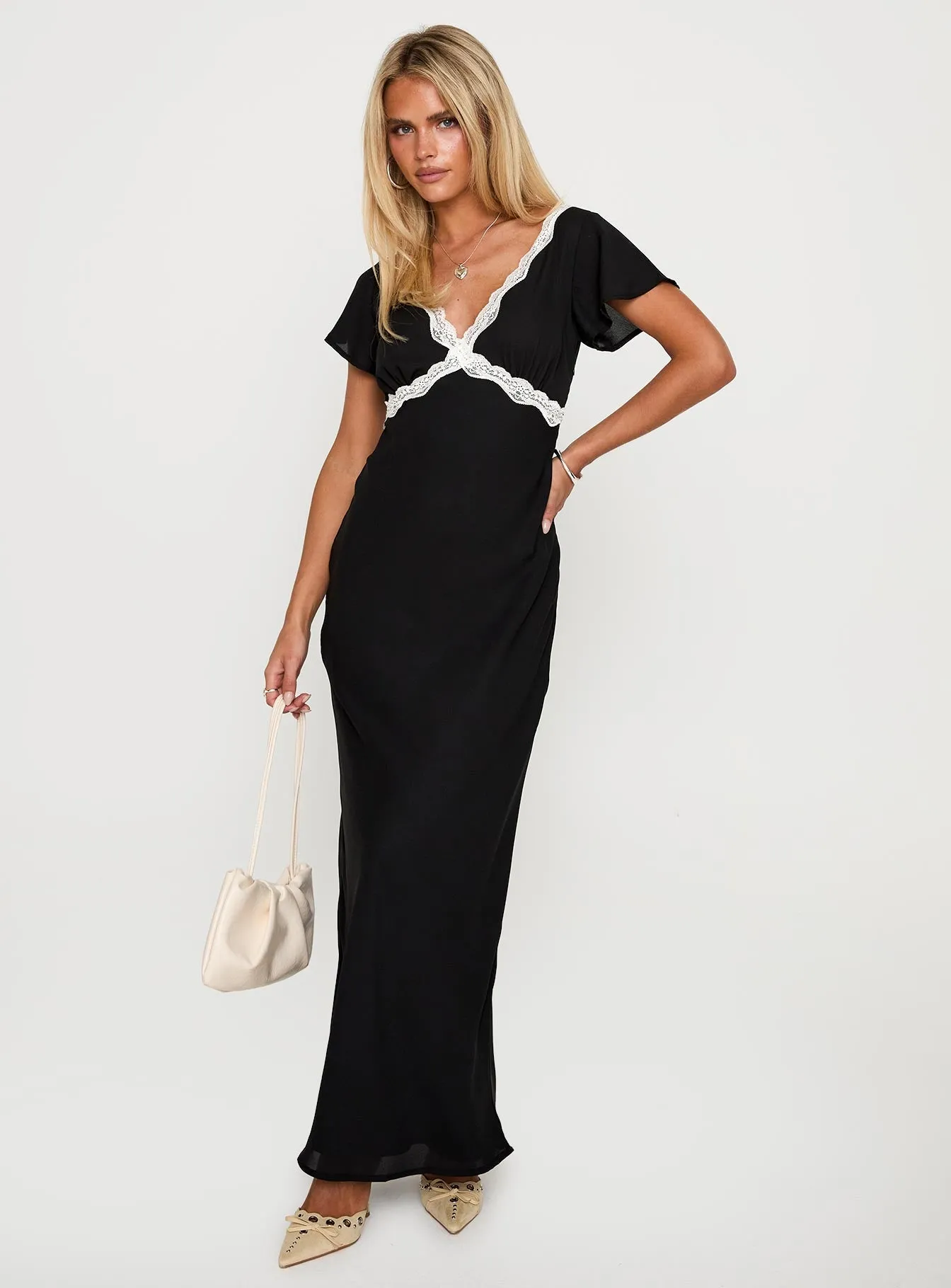 Barbarita Lace Maxi Dress Black The classic design of this maxi dress makes it an essential piece for any fashion-forward wardrobe Fold Art