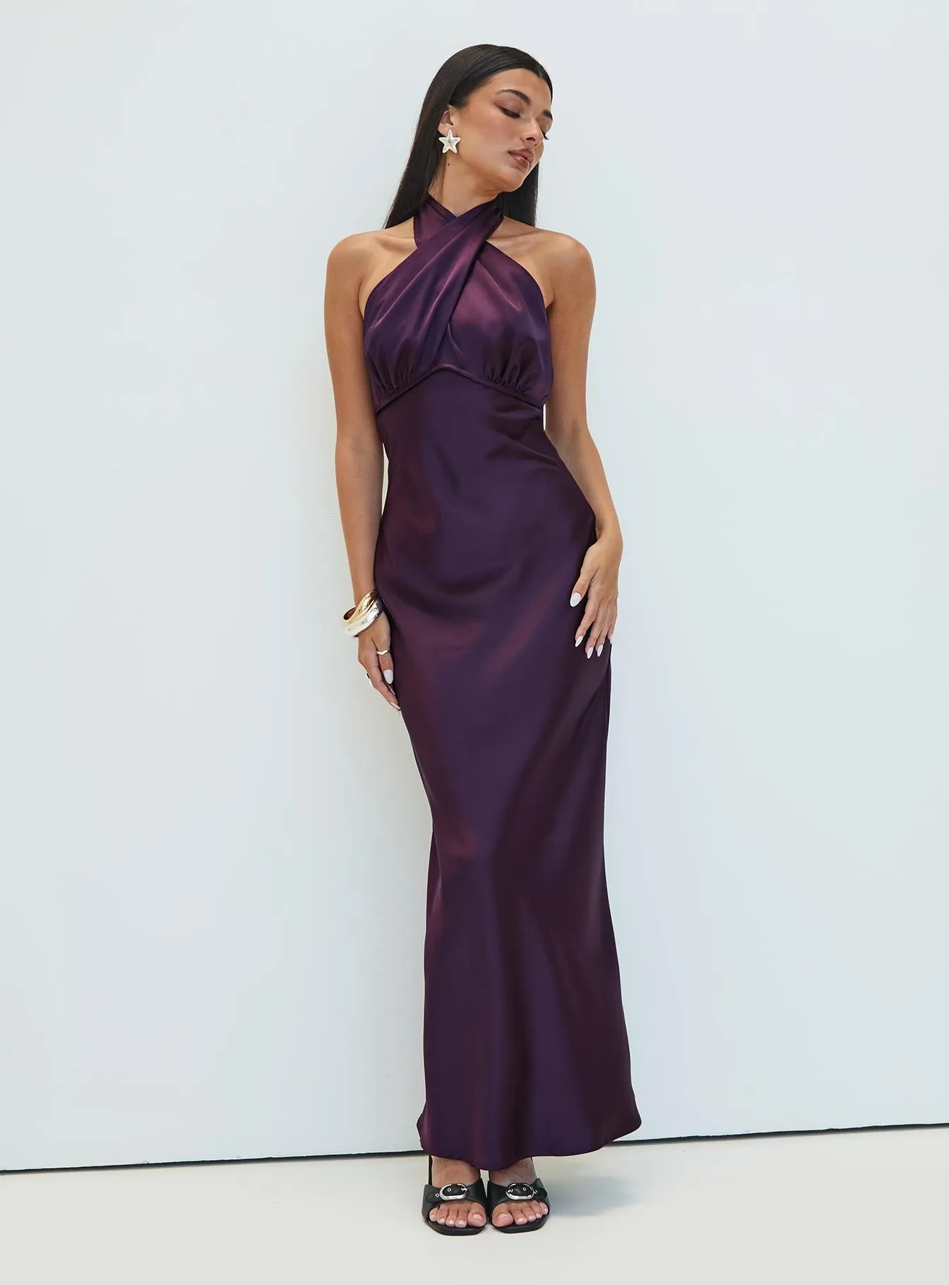 With a flattering shape and versatile design this dress is perfect for all occasions Rosaminta Halter Maxi Dress Plum