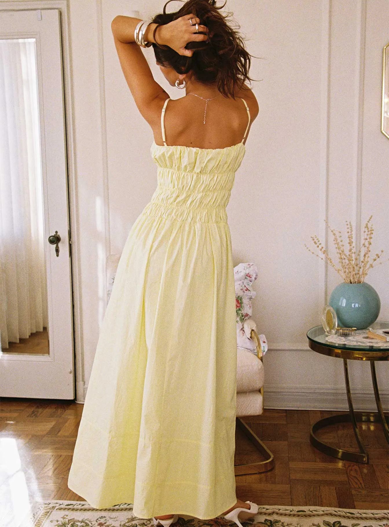 This dress is a versatile option that can be styled in many different ways Loralei Shirred Maxi Dress Yellow