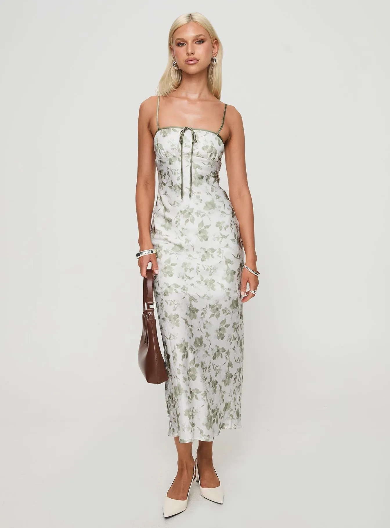 This dress provides the ideal balance of style and comfort making it a wardrobe essential Vasiliki Maxi Dress White / Green Floral