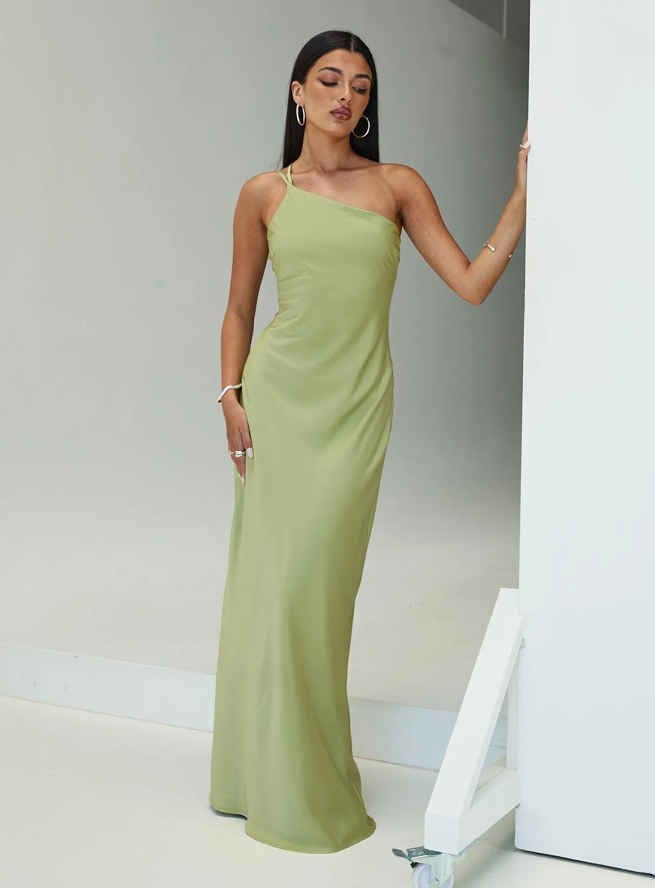 The simple yet refined design of this dress makes it easy to pair with different accessories Sapphire Glow Nehemiah One Shoulder Maxi Dress Green