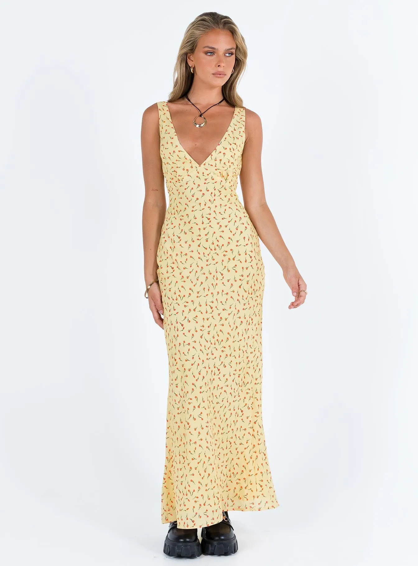 The elegant cut of this dress ensures you look chic and feel comfortable throughout the day Nellie Maxi Dress Yellow / Red Floral