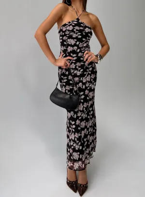 Ruffle Hem Perfect for warmer months this dress provides a light and breezy fit without sacrificing style Anisa Halter Maxi Dress Black Floral